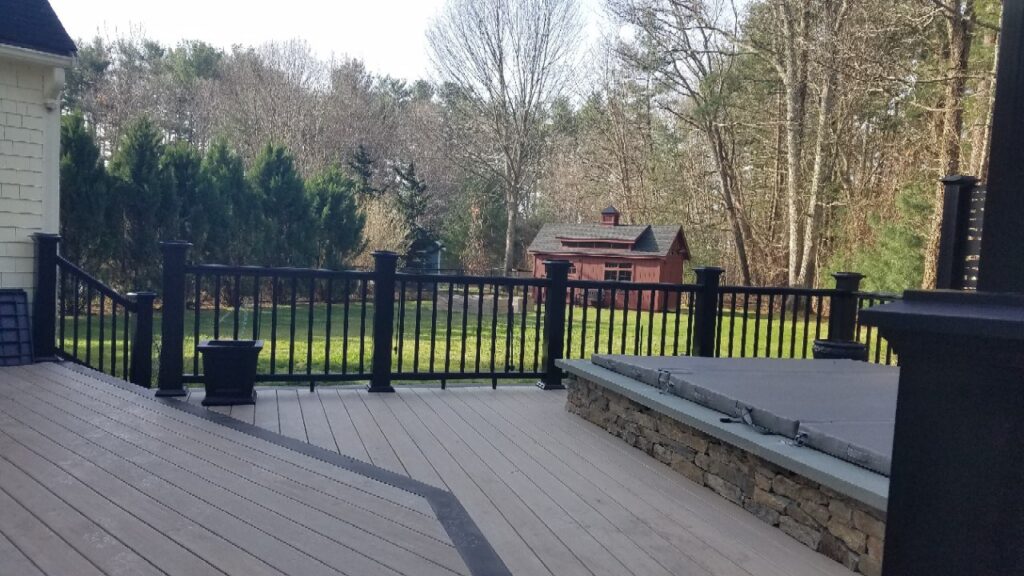 Timbertech deck around pool with black railings