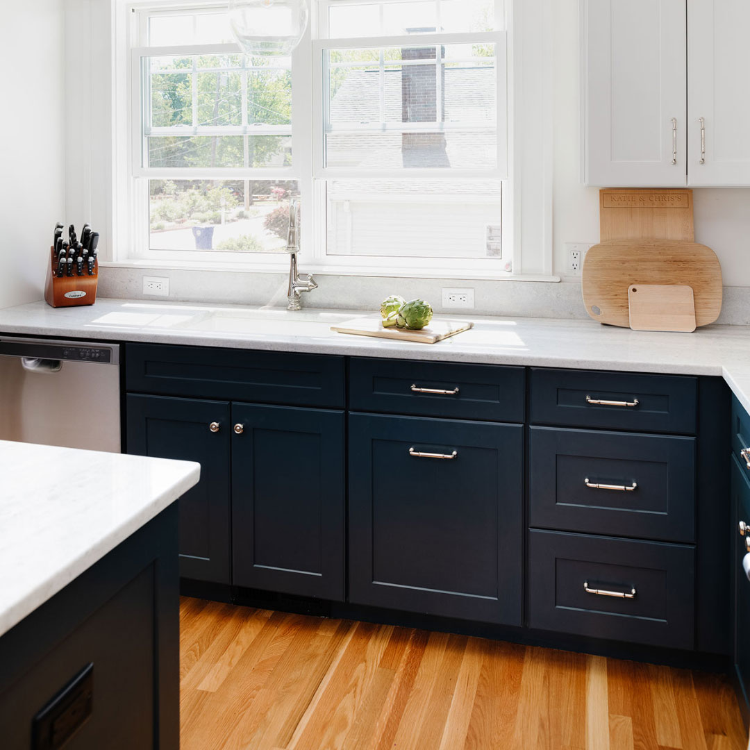 Dark kitchen cabinets with white countertop