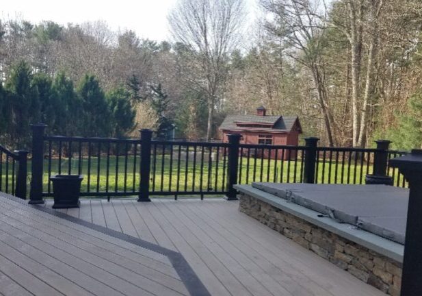 Timbertech deck around pool with black railings