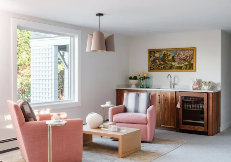 Almar Building, Featured basement remodel featuring a wetbar and pink armchairs