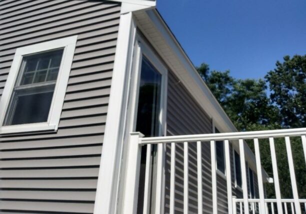 Almar Building installing gray certainteed vinyl siding with white trim. Pembroke Ma