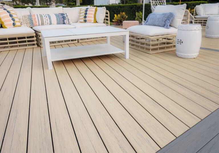 High-performance composite decking boards showing the protective capping that prevents cracking and peeling during harsh New England winters.
